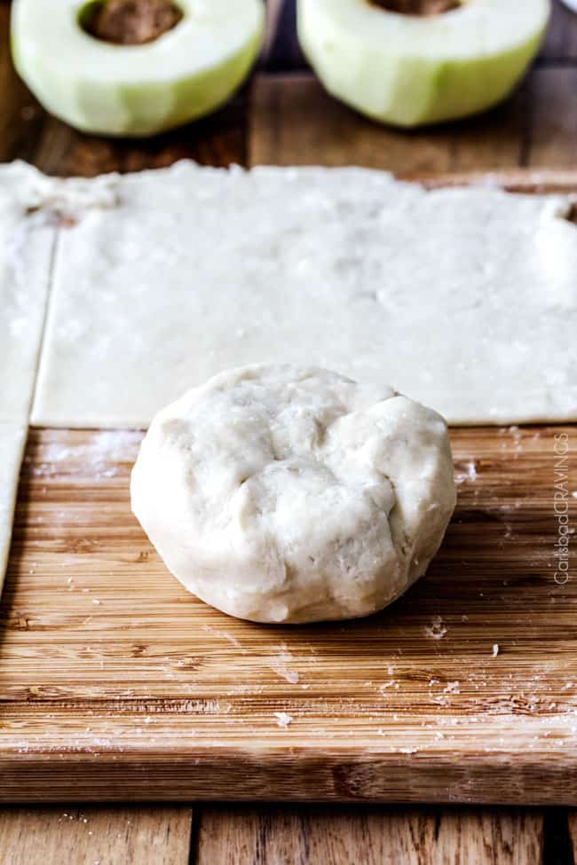 showing how to make apple dumplings by brushing dough with an egg wash before baking