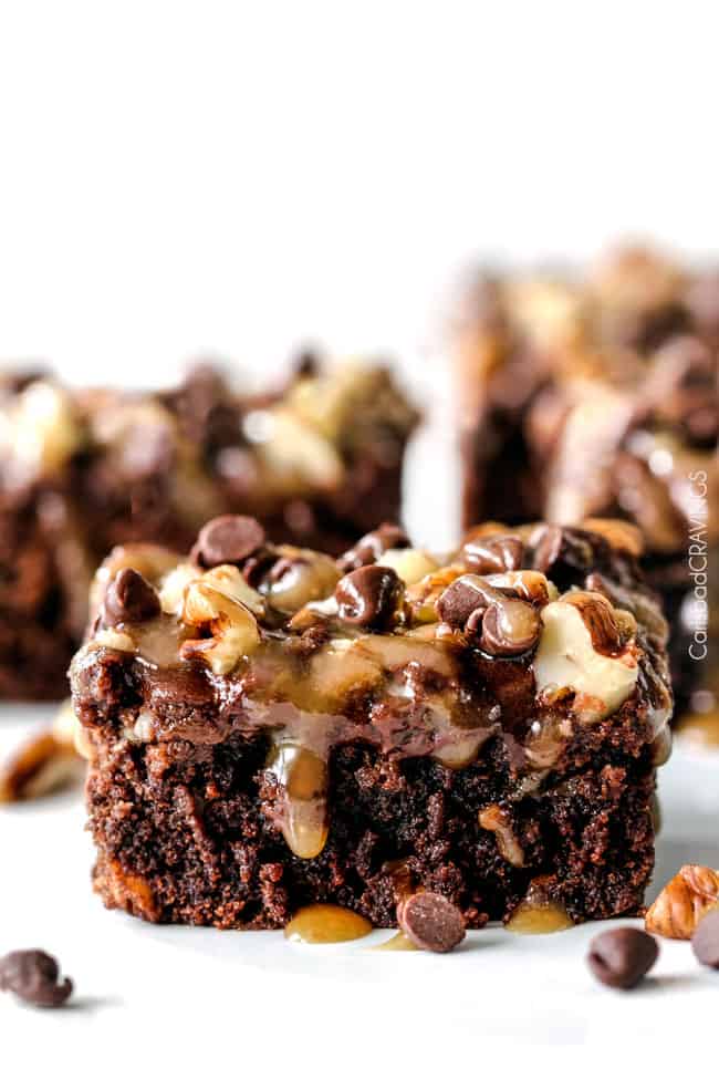 up close of a slice of easy Turtle Brownies with caramel, pecans and chocolate chips