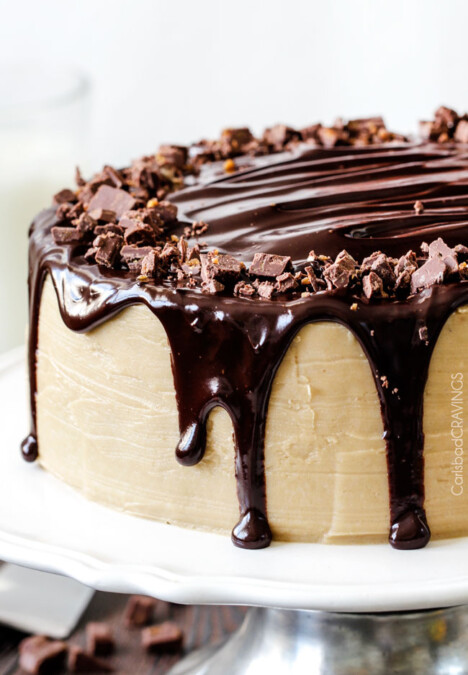 Crazy moist Caramel Milk Chocolate Cake, busting with milk chocolate toffee bits, coated in Caramel Icing and smothered in silky chocolate ganache. THE only chocolate cake recipe you need!