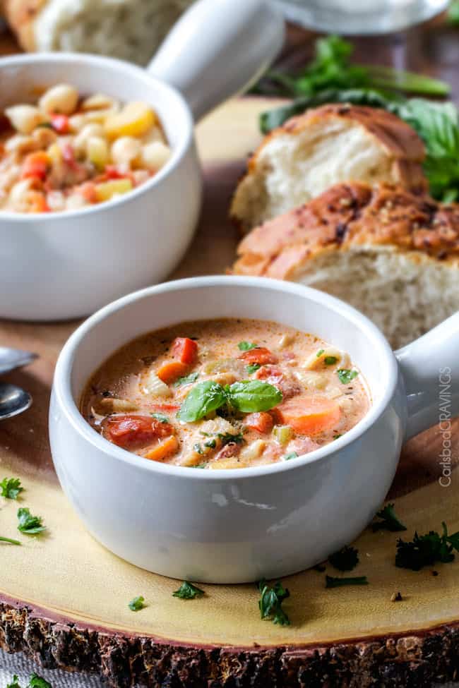 Creamy Basil Parmesan Italian Soup tastes better than any restaurant soup! Super easy and seasoned to perfection bursting with tender chicken, tomatoes, carrots, celery and macaroni enveloped by creamy Parmesan.