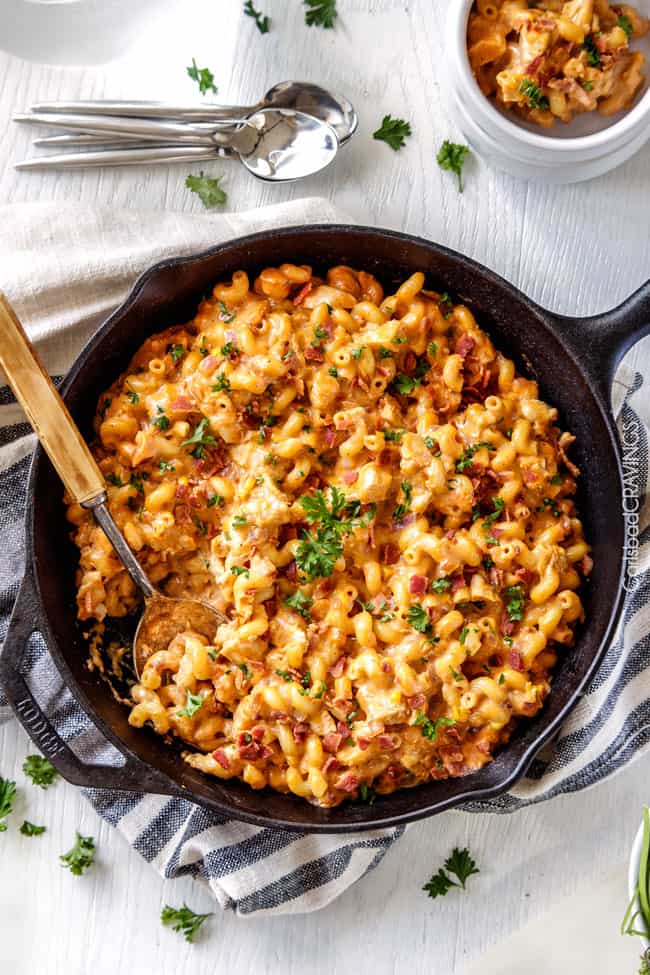 top view of tasty Buffalo Chicken Mac and Cheese in a skillet with a serving spoon