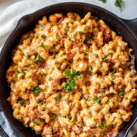 Lightened Up Buffalo Bacon Chicken Macaroni and Cheese is crazy creamy without any heavy cream or butter (but with a secret ingredient instead!), less than 10 minutes prep and is so bursting with flavor you will be licking your plate!