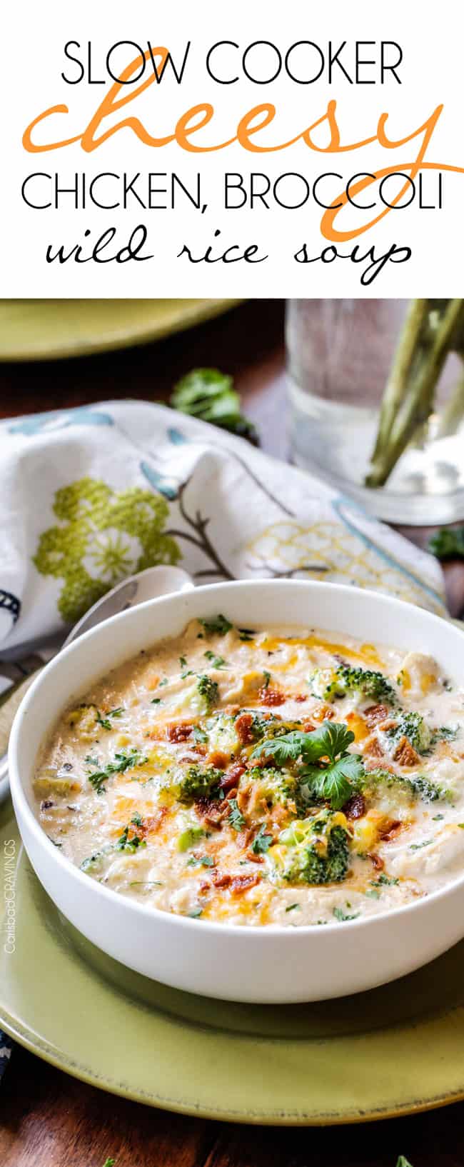 easy creamy chicken and rice soup in a white bowl with cheese on top