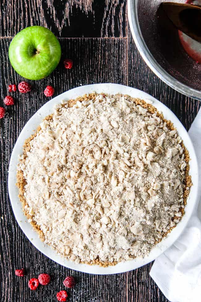 Easy Raspberry Apple Pie with Oatmeal Cookie Crumble Topping is an amazinlgy delicious twist on classic apple pie that everyone will go crazy for! I could eat the crust, filling or topping alone - every part is so good!