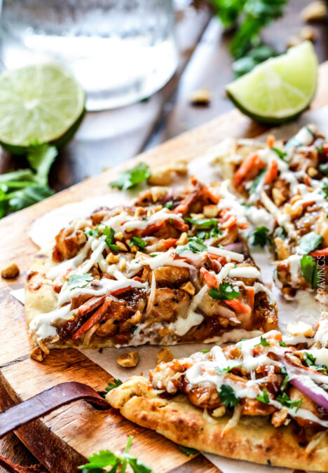 CPK inspired 20 Minute Thai Chicken Flatbread Pizza smothered in easy tangy peanut sauce, tender chicken, mozzarella cheese, crunchy carrots, sprouts and peanuts and the option of creamy coconut yogurt drizzle - an amazing flavor bursting quick dinner at a fraction of the cost.