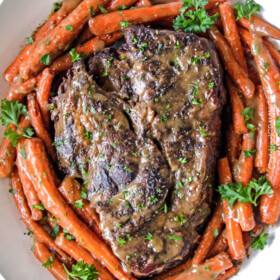 Melt in Your Mouth Pot Roast and carrots with mouthwatering gravy is the best pot roast I have ever had! Juicy, fall apart tender, seasoned to PERFECTION with hardly any effort! Amazing for company, easy enough for everyday.