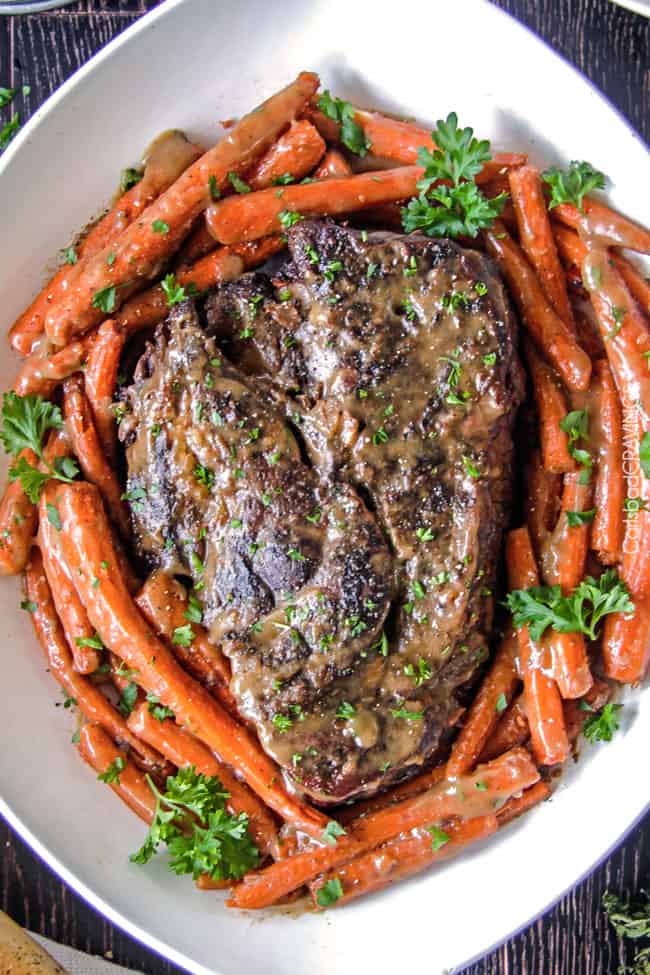 Melt in Your Mouth Pot Roast and carrots with mouthwatering gravy is the best pot roast I have ever had! Juicy, fall apart tender, seasoned to PERFECTION with hardly any effort! Amazing for company, easy enough for everyday.