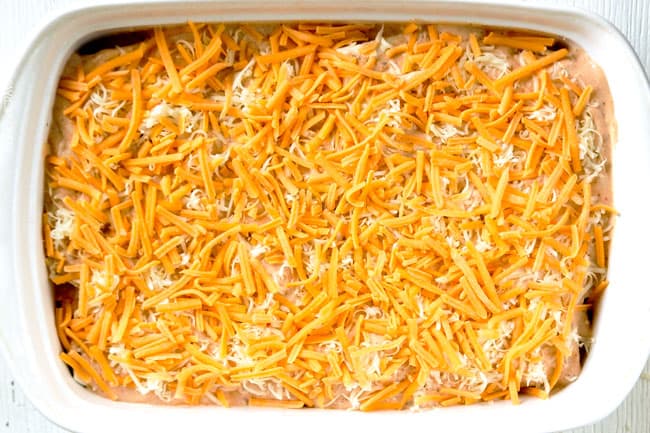 showing how to make breakfast enchiladas by topping casserole dish with cheese