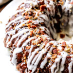 Maple Bacon Cinnamon Roll Monkey Bread made easy with refrigerated cinnamon rolls and made irresistible with maple crispy crumbled bacon, pecans and a maple caramel topping. The perfect special occasion breakfast, brunch or dessert!