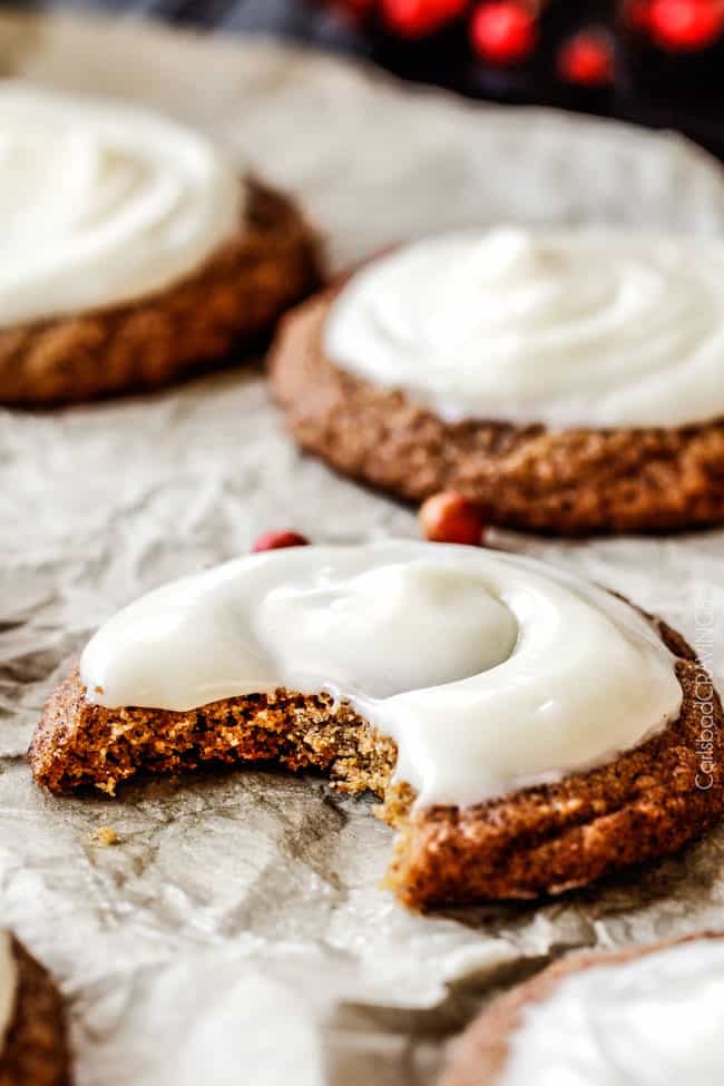 A bite out of a Soft Gingersnap Cookies with Eggnog Frosting.