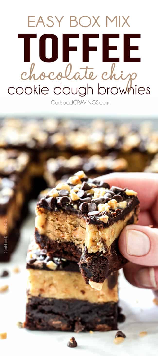Holding a Toffee Chocolate Chip Cookie Dough Brownie with a bite.