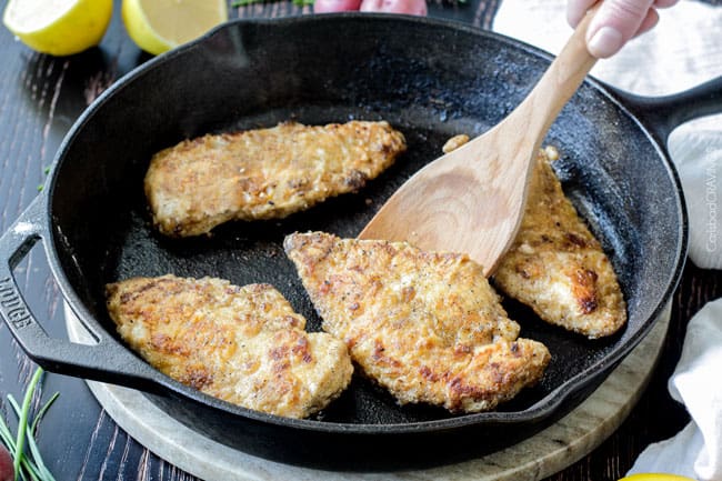Showing how to make Chicken and Potato Skillet by cooking the chicken.