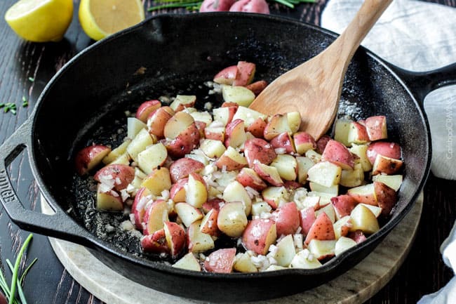 Showing how to make Chicken and Potato Skillet by cooking the red potatoes. 