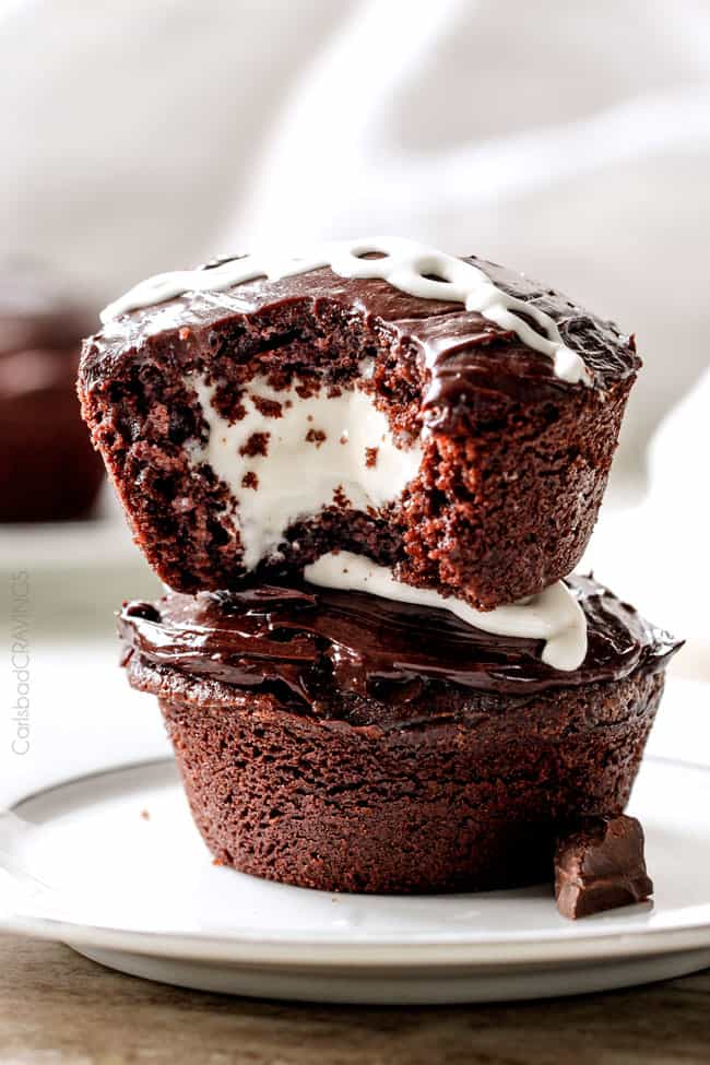Ding Dong Cupcakes are a rich, moist chocolate cupcake stuffed with creamy marshmallow filling and smothered in a silky chocolate ganache! You will never want to buy Ding Dongs from the store again!