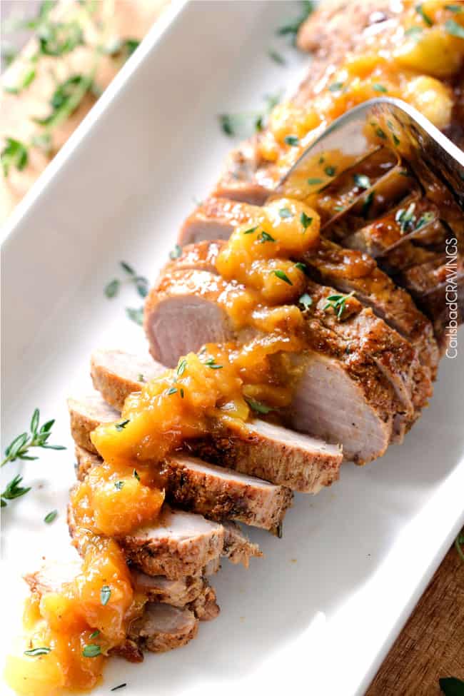 showing how to serve roasted pork tenderloin by serving with a fork