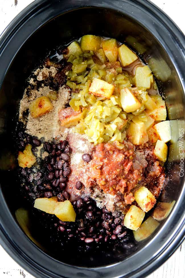 Adding all the ingredients to the Slow Cooker Pineapple Salsa Pork.
