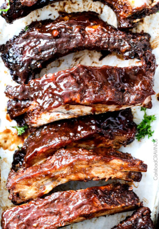 15 minute prep Fall-Off-the-Bone Slow Cooker Barbecue Ribs that everyone goes crazy for! They are slathered in the most incredible rub and barbecue sauce for amazing restaurant flavor. My husband says they are better and more tender than any restaurant!