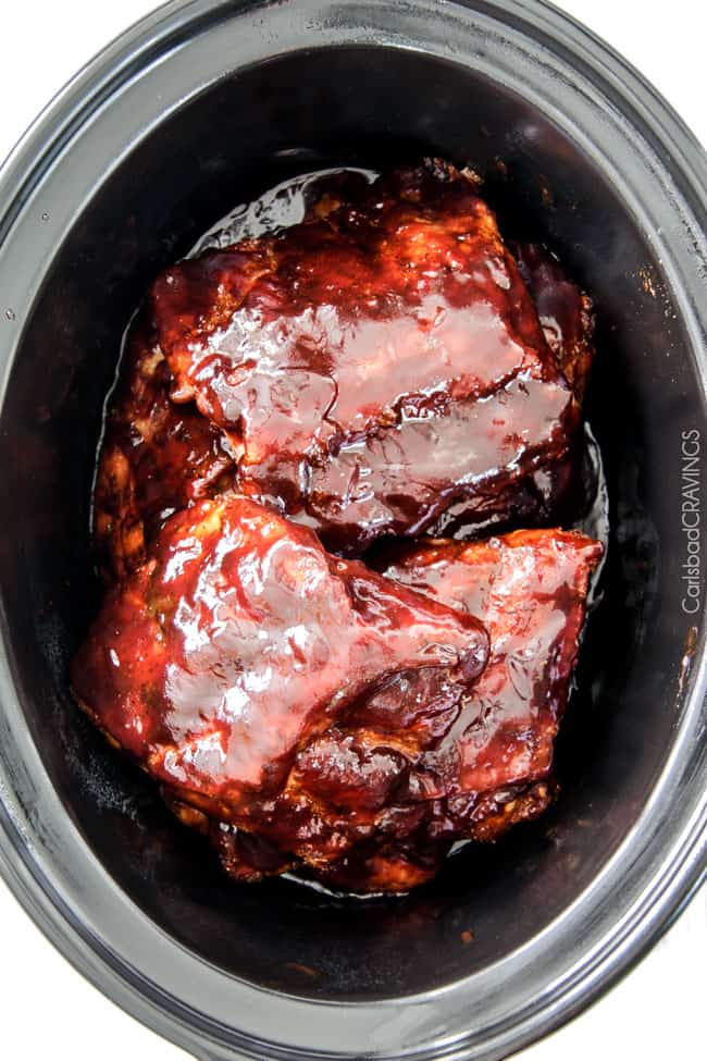 15 minute prep Fall-Off-the-Bone Slow Cooker Barbecue Ribs that everyone goes crazy for! They are slathered in the most incredible rub and barbecue sauce for amazing restaurant flavor. My husband says they are better and more tender than any restaurant!