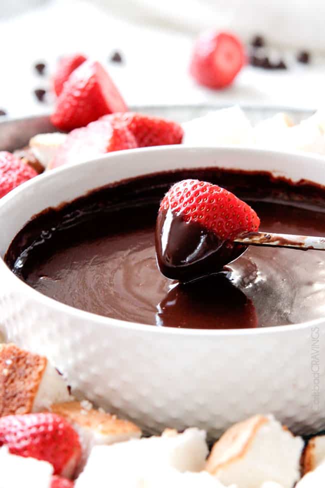 up close of a strawberry dipped in classic chocolate fondue recipe