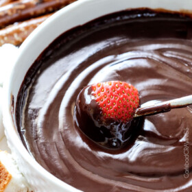 Slow Cooker Chocolate Fondue - EASY, velvety chocolate is the perfect make ahead party or special occasion appetizer or dessert. Perfect for Valentine's Day or baby/bridal showers!
