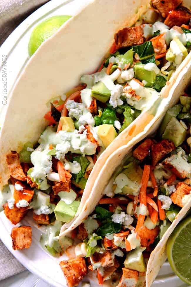 A close up of Showing how to make Buffalo Chicken Tacos.