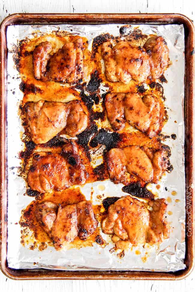 top view of baked sweet and spicy chicken on a baking sheet. 
