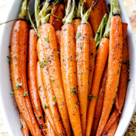 Tender, sweet and savory Secret Ingredient Honey Garlic Roasted Carrots are the most delicious carrots and easiest side dish EVER with only 10 minutes prep! I eat these like candy! #Thanksgiving #Easter #Christmas