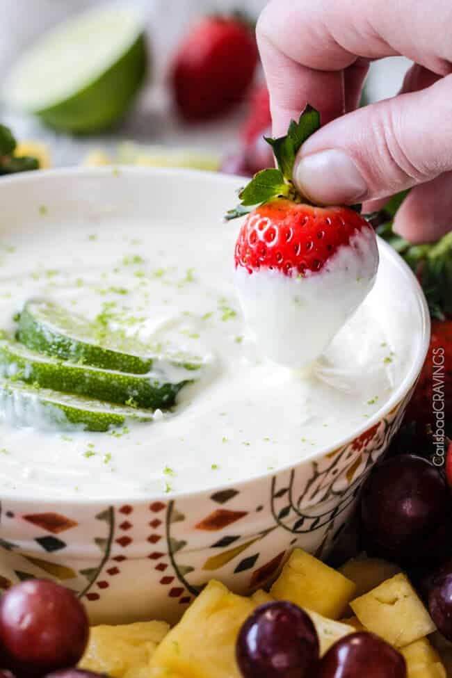 pulling a strawberry out of cream cheese Fruit Dip