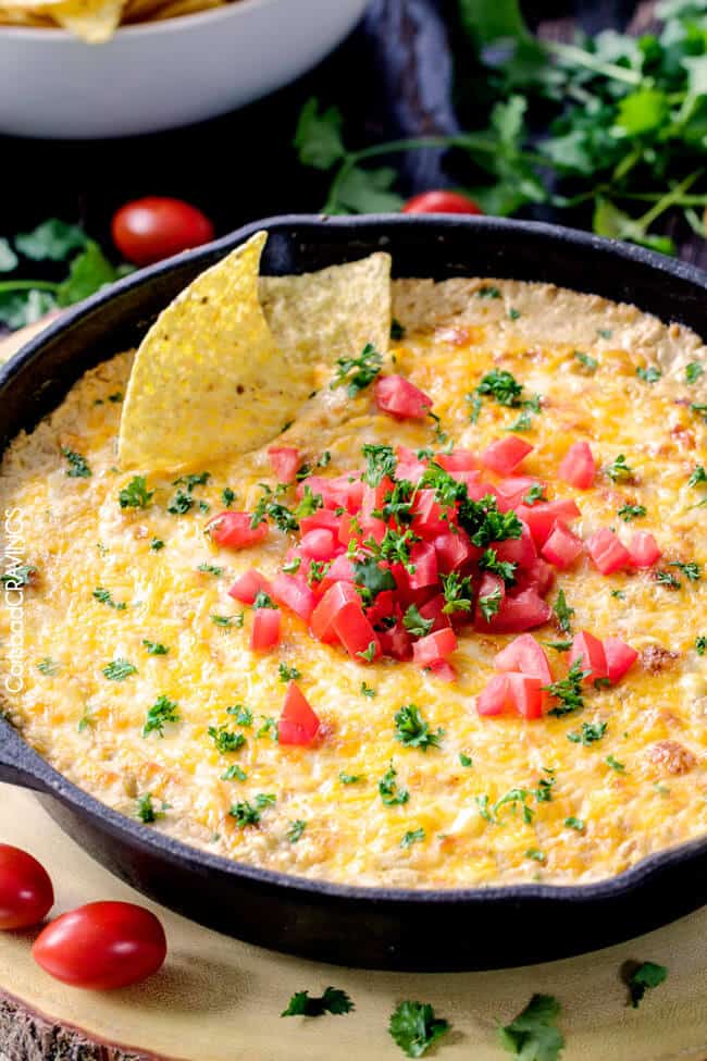 top view of Mexican fresh Corn Dip topped with tomatoes and cilantro