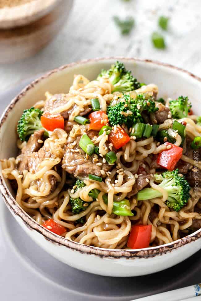 Close up of Beef and Broccoli Noodle Bowls with sesame seeds.