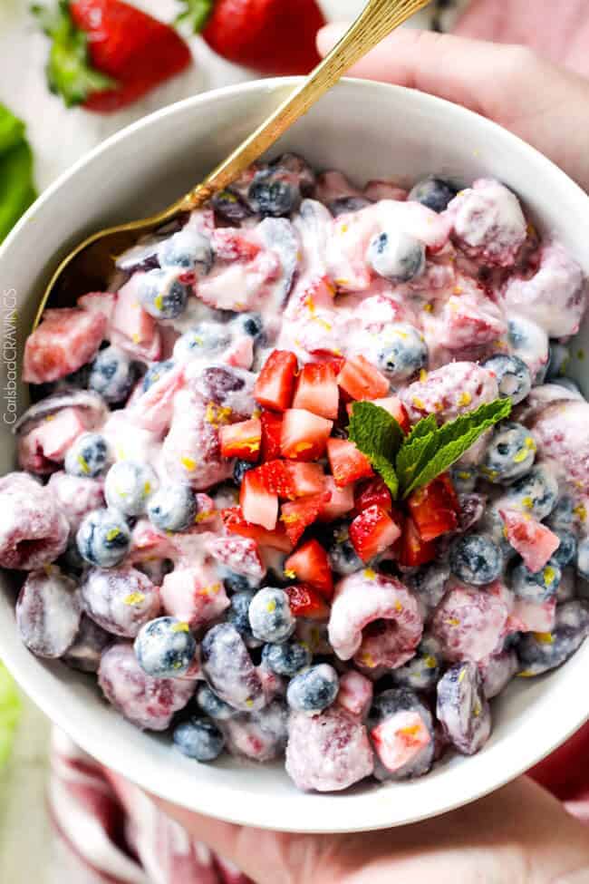 Fresh Berry Salad is one of the BEST fruit salads you will ever make! Smothered in sweet and tangy, incredibly creamy Honey Mascarpone that takes minutes to whip up and tastes incredible! Perfect for brunch, barbecues and all your pool side parties!