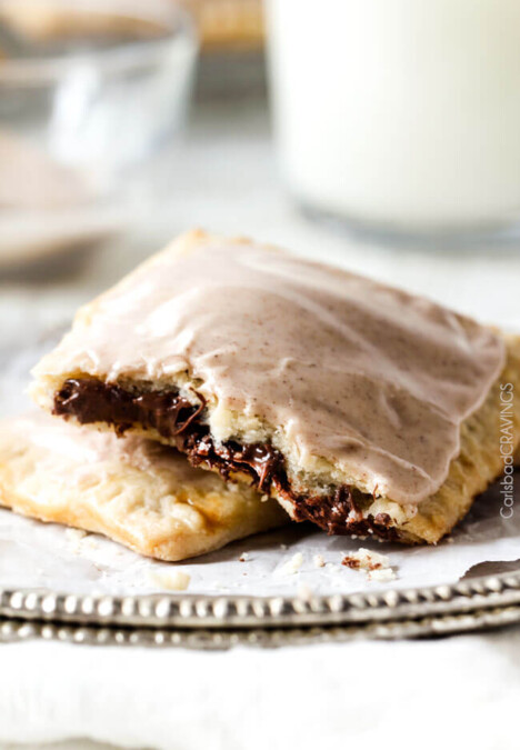 Melt in-your-mouth Nutella Brown Sugar Pop Tarts cocooned in buttery, flaky pastry smothered with Cinnamon Vanilla Icing are 1000X better than store-bought and so good you will never go back to the box kind again!