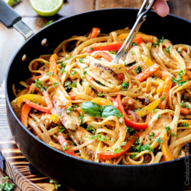 Cajun Chicken Pasta in the most amazing flavor bursting creamy Sun-dried Tomato Alfredo Sauce! The juicy spice rubbed chicken melts in your mouth and the pasta is 10000x better than any restaurant at a fraction of the cost and calories!
