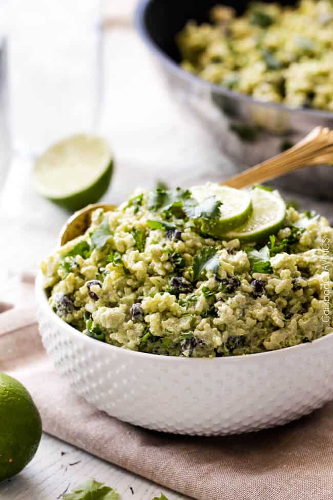 Creamy Cilantro Lime Avocado Rice in a white bowl with lime.