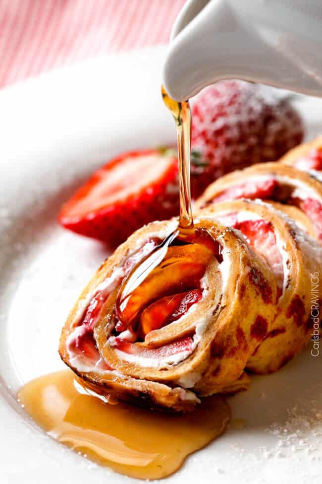 Flatbread French Toast Roll Ups or French Toast Pinwheels with strawberries and syrup. 