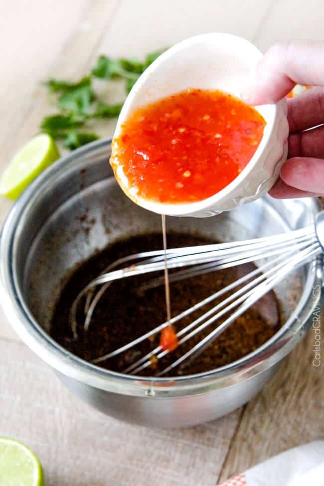 showing how to make chili enchiladas by whisking sweet chili sauce together with lime juice and honey