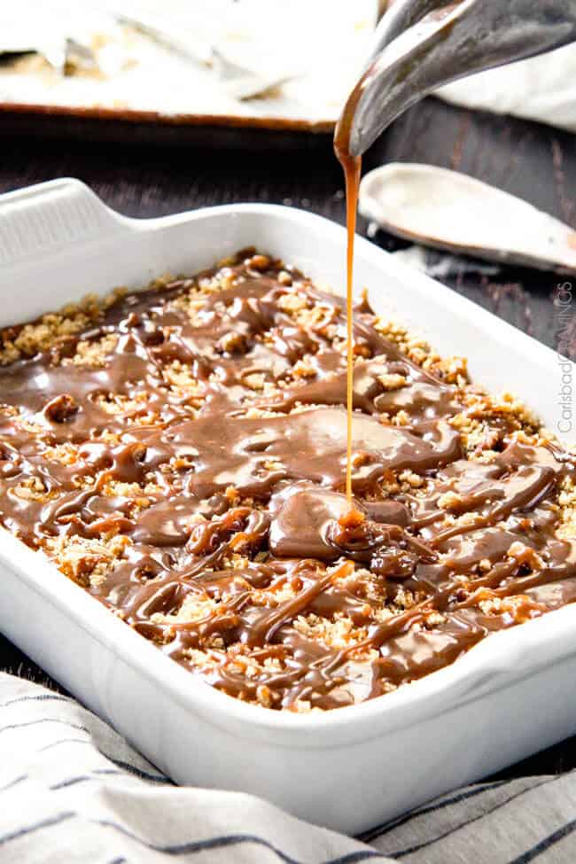 showing how to make ice cream cake by pouring caramel over cookie crumble layer