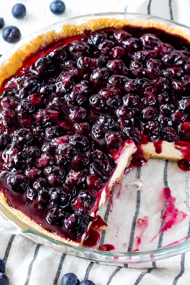 Baked Blueberry Cheesecake Recipe with slices taken out of the whole cheesecake