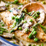 Creamy Parmesan Pesto Chicken Skillet - this is the BEST one skillet Chicken! the chicken is rubbed in pesto/Parmesan for amazing flavor and the sauce is the creamiest, most flavorful, all done in 30 minutes! I love mine with pasta, my husband loves his with potatoes!