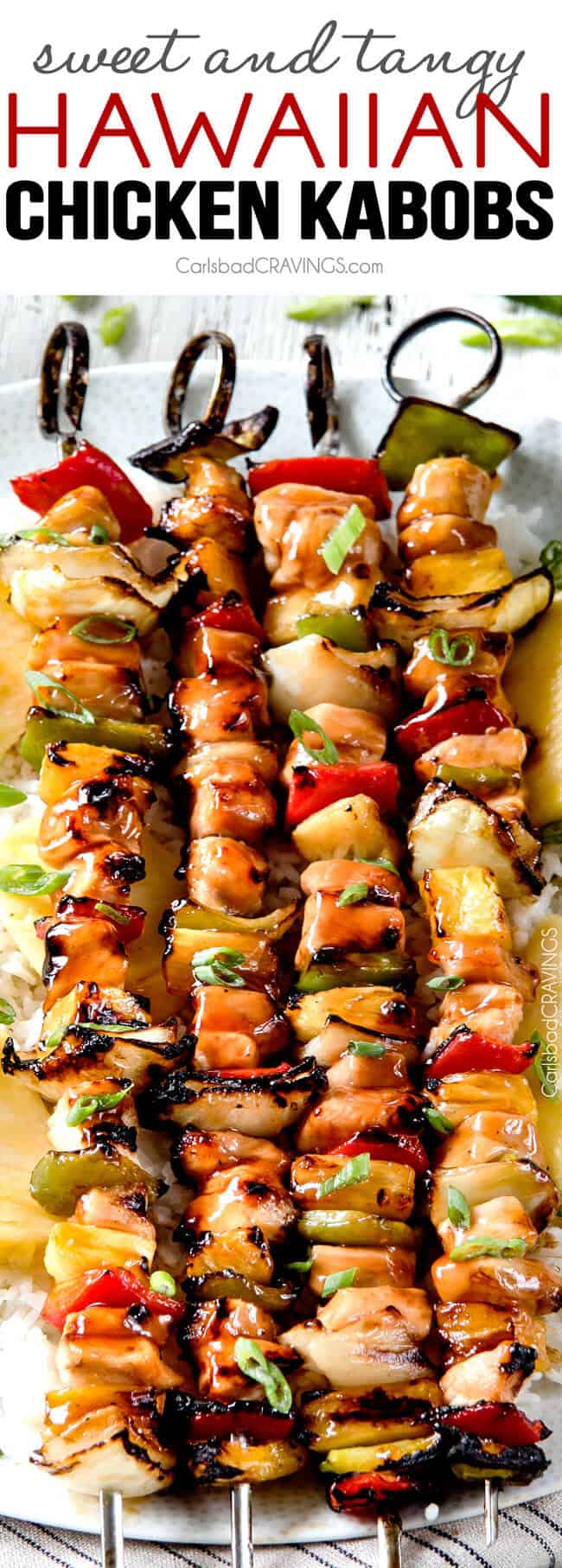 close up shot of four chicken pineapple kabobs on rice