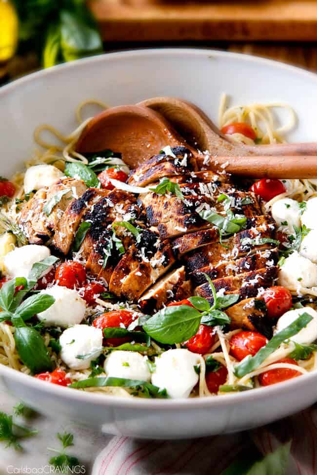 Caprese Chicken Pasta in a bowl with grilled chicken.