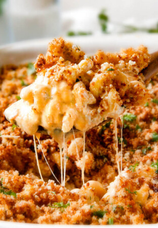 This mega creamy Million Dollar Macaroni and Cheese Casserole is the only macaroni cheese recipe you will ever want to make! make this for guests or family and they will love you forever! The homemade sauce itself is rich and crazy creamy and the casserole is stuffed with a hidden layer of provolone cheese and sour cream that melts when baked for a ridiculous amount of velvety creamy, cheesy goodness.