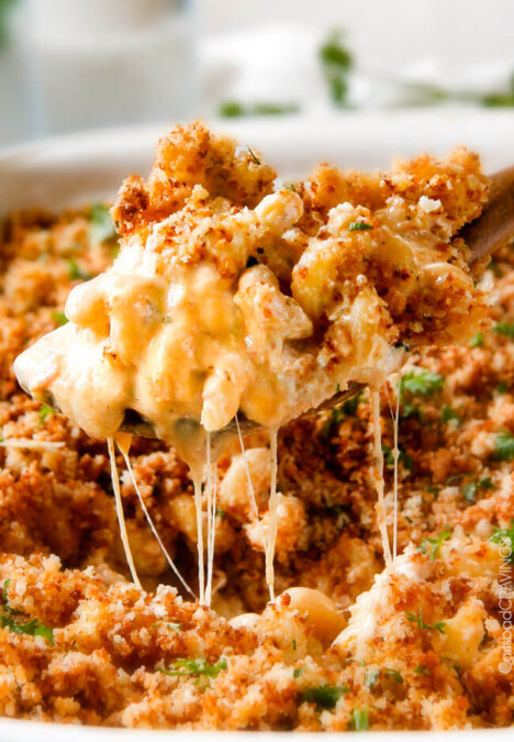 This mega creamy Million Dollar Macaroni and Cheese Casserole is the only macaroni cheese recipe you will ever want to make! make this for guests or family and they will love you forever! The homemade sauce itself is rich and crazy creamy and the casserole is stuffed with a hidden layer of provolone cheese and sour cream that melts when baked for a ridiculous amount of velvety creamy, cheesy goodness.