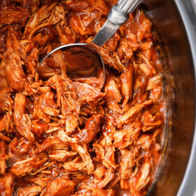 Slow Cooker BBQ Chicken - this is our family's favorite BBQ chicken! Its tender, tangy, sweet, smoky and the homemade barbecue sauce is out of this world! I love making this for busy days or large gatherings!