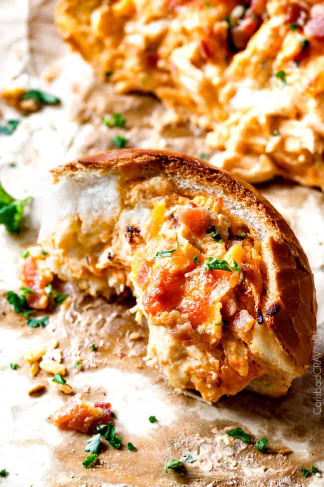 Buffalo Chicken Dip (Stuffed French Bread) with a bite out of a piece. 