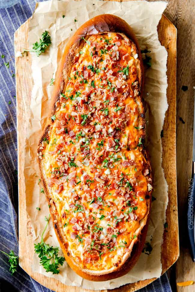 Showing a baked Buffalo Chicken Dip (Stuffed French Bread)