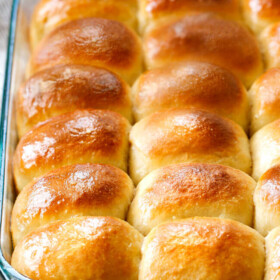 sweet, buttery, Hawaiian Sweet Rolls are super soft and fluffy infused with pineapple juice and slathered in butter! My family LOVES these! perfect for sliders, potlucks and special occasions like Thanksgiving!