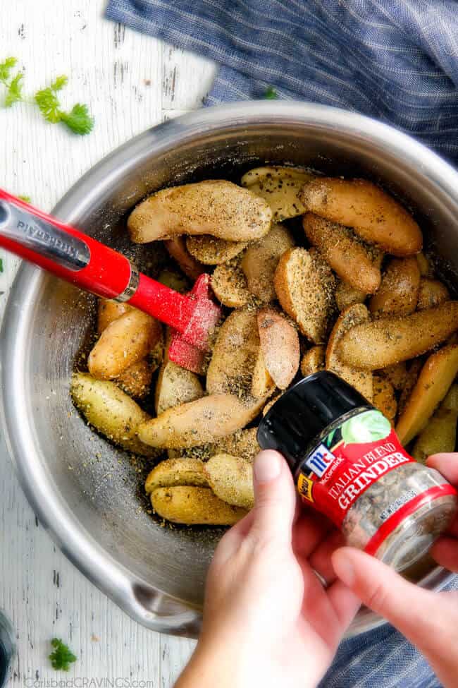 Showing how to make Baked Parmesan Fingerling Potato Fries adding spices. 