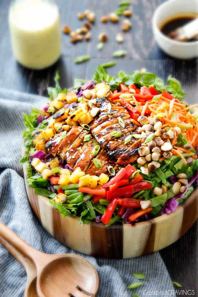 Teriyaki Chicken Salad with Pineapple Sesame Dressing in a wood bowl.