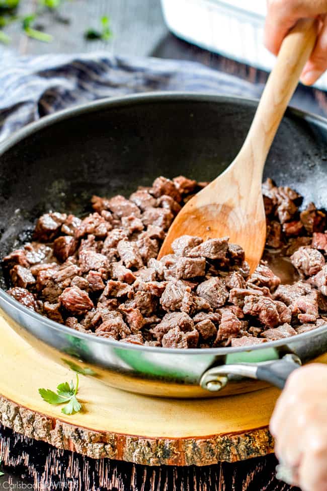 showing how to make Shepherd's Pie by browning meat in a skillet